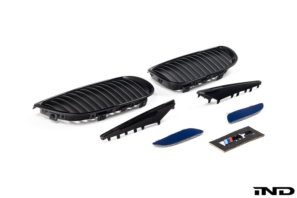 IND E9X M3 exterior cosmetic package, close-up of black carbon fiber accents and body enhancements on a BMW E9X M3.