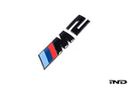 BMW F87 M2 Competition front grille emblem, exterior badge featuring BMW logo on the M2 CS model.