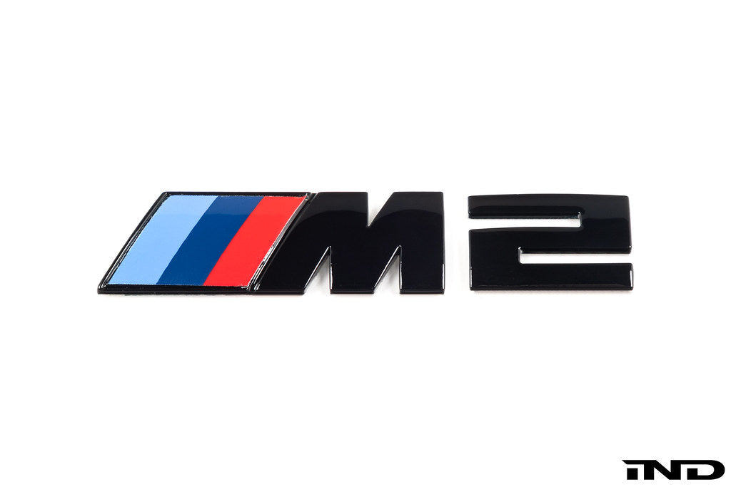 BMW F87 M2 Competition front grille emblem, exterior badge, chrome finish, mounted on the vehicle's front grille.