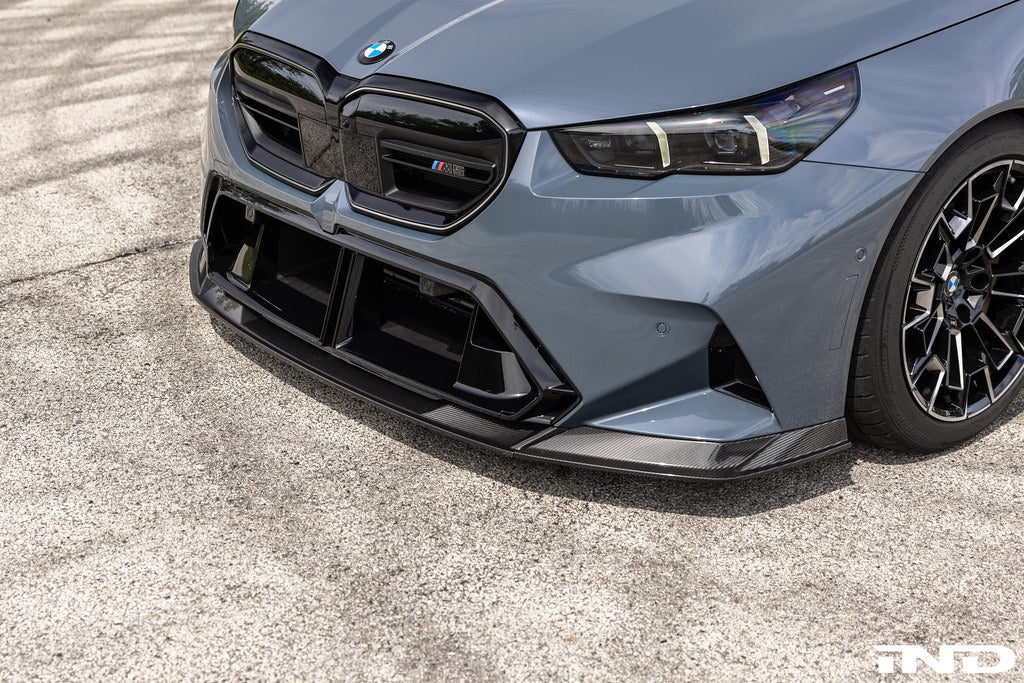 TREVORA G90 G99 M5 carbon fiber front splitter for exterior car enhancement, shown on a vehicle with a sleek aerodynamic design.