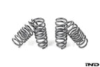MMX Performance G90/G99 M5 xDrive suspension lowering spring set installed on a vehicle, showcasing upgraded suspension components.