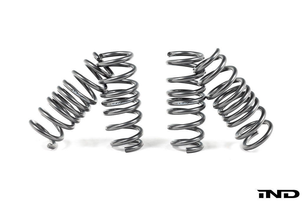 MMX Performance G90 G99 M5 xDrive suspension lowering spring set installed on vehicle, showcasing upgraded suspension components.