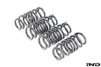 MMX Performance G90 G99 M5 xDrive suspension lowering spring set installed on a vehicle, showcasing the black springs for improved ride.