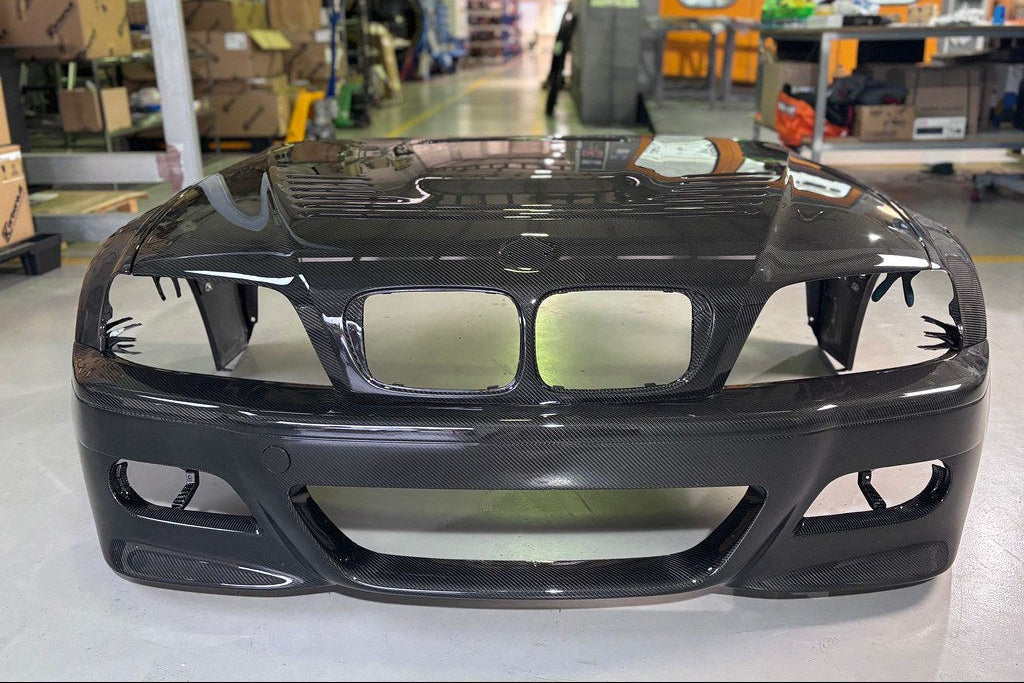 Karbonius E46 M3 carbon front bumper cover for exterior, showing sleek, lightweight carbon fiber design on a BMW E46 M3.