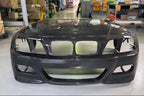 Karbonius E46 M3 carbon front bumper cover for exterior, showing sleek, lightweight carbon fiber design on a BMW E46 M3.