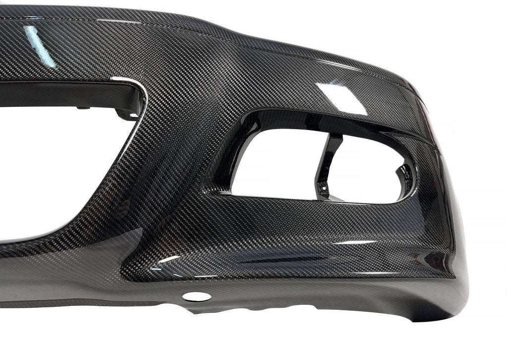 Karbonius E46 M3 carbon front bumper cover exterior car part shown on vehicle, highlighting lightweight, aerodynamic design.