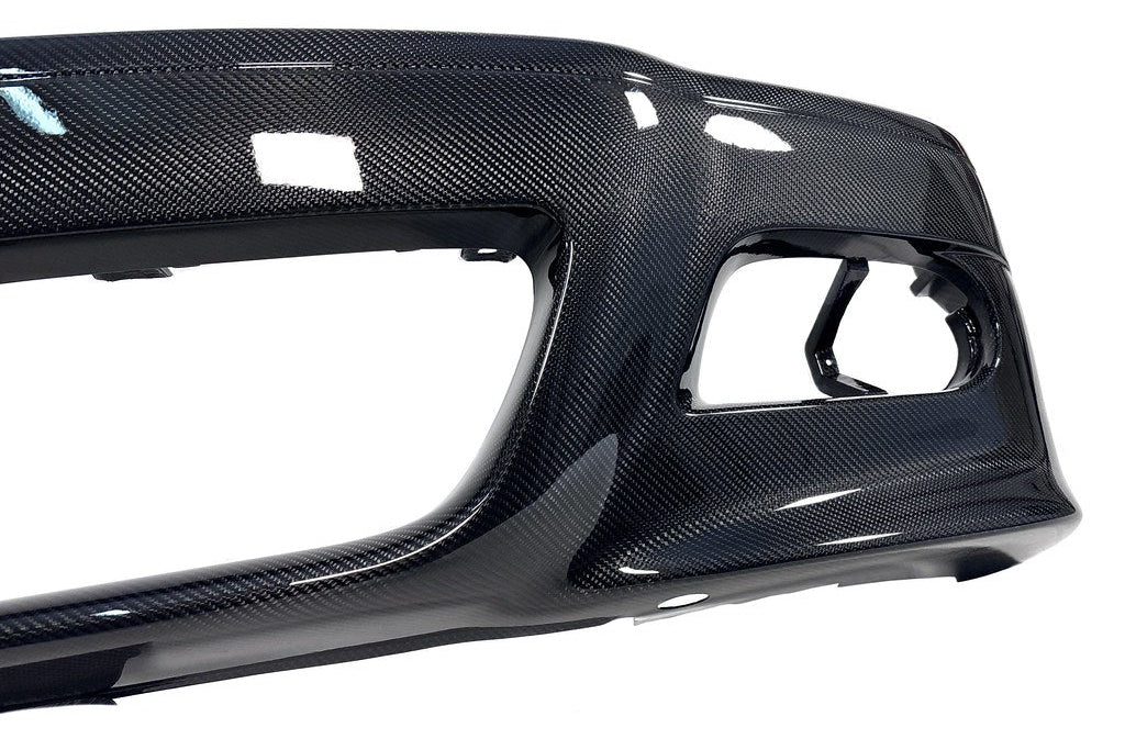Karbonius E46 M3 carbon fiber front bumper cover showing sleek exterior design and detailed finish on the car.