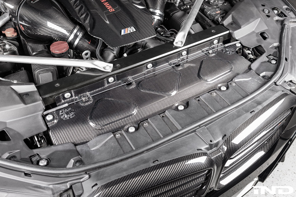 AutoTecknic F95 X5M and F96 X6M dry carbon fiber cooling shroud installed on a G09 XM SUV, showcasing sleek exterior design.