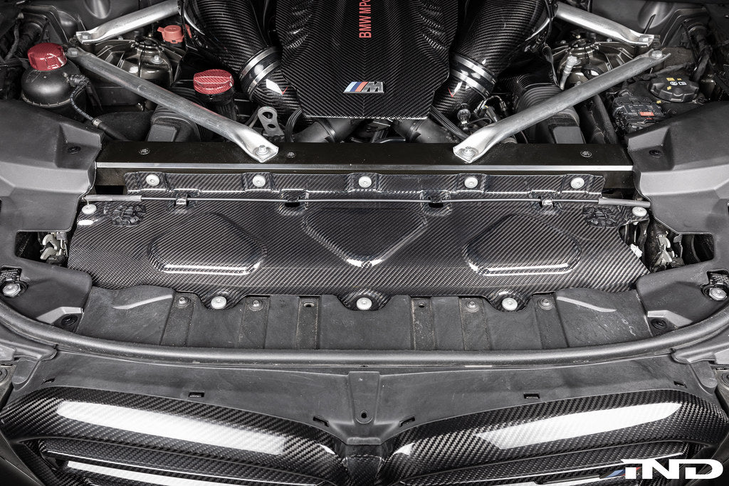 AutoTecknic F95 X5M and F96 X6M dry carbon fiber exterior cooling shroud on car.