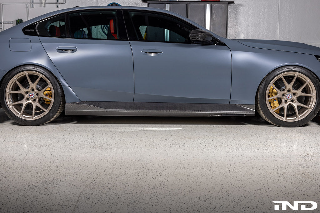 3D Design G90 G99 M5 carbon fiber side skirts for BMW, exterior car accessories, shown on vehicle for enhanced sporty look.