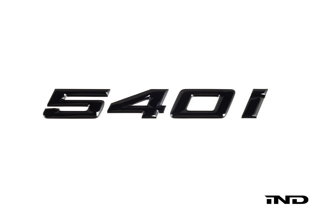 IND G30 540i painted trunk emblem for BMW 540i, exterior car badge with black finish and detailed logo on the trunk lid.