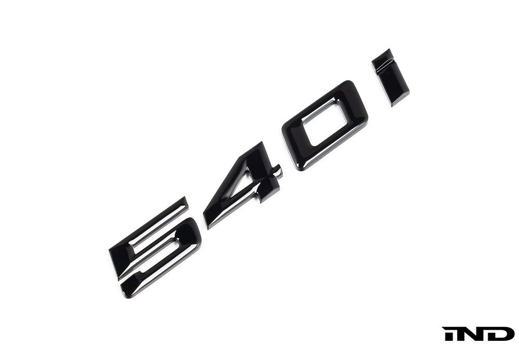 IND G30 540i painted trunk emblem for BMW 5 Series exterior, showcasing the sleek, glossy badge on the vehicle's trunk.