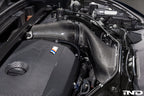 Eventuri black carbon intake system installed in BMW F7X M135 M235, X1 X2 M35i B48 performance car engine bay
