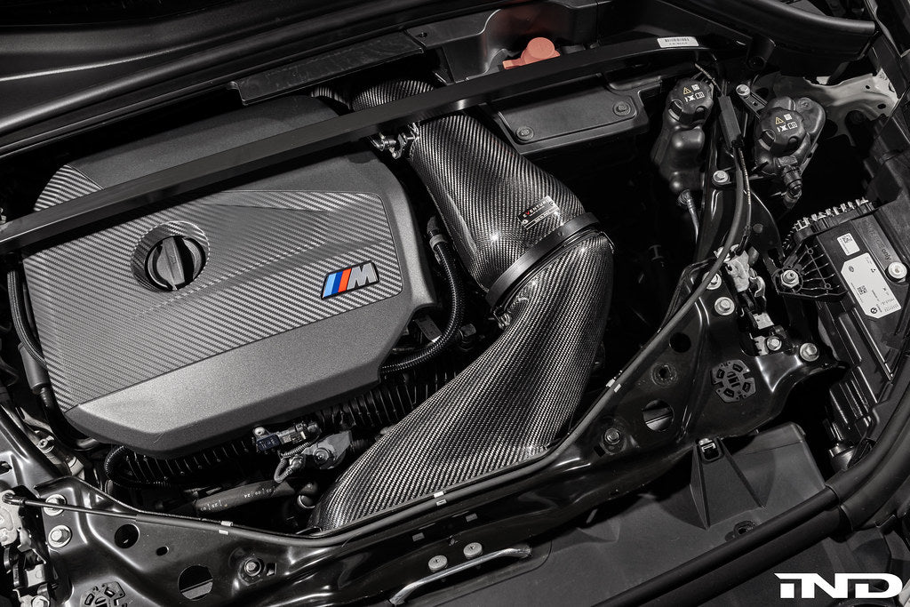 Eventuri black carbon intake system for BMW F7X M135 M235 X1 X2 M35i, performance air intake with sleek carbon finish.