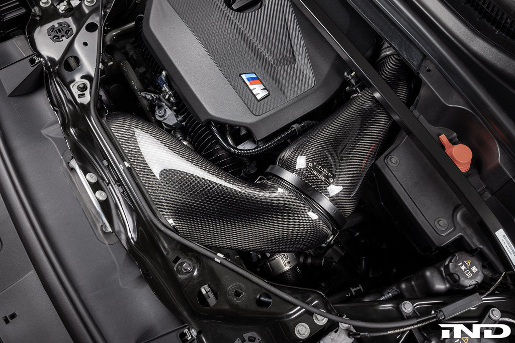 Eventuri black carbon intake system for BMW F7X M135 M235 and X1 X2 M35i with performance upgrade, featuring sleek carbon fiber design.