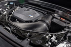 Eventuri black carbon intake system for BMW F7X M135 M235 X1 X2 M35i performance upgrade, showing sleek airflow components.