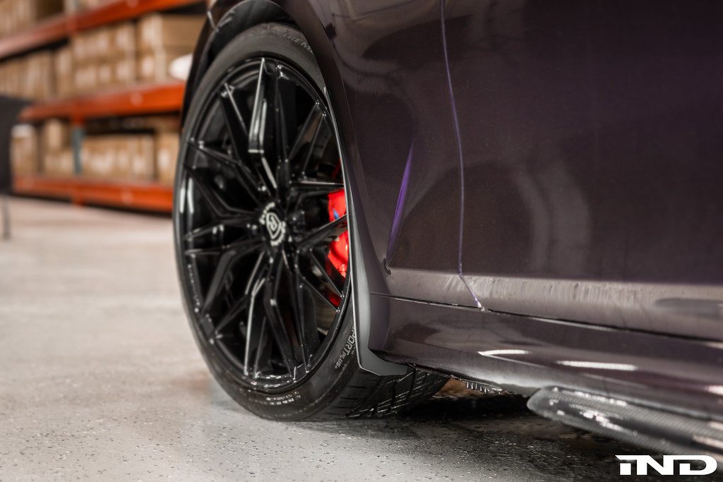 Megachip G20 3-Series exterior splash guards installed on a vehicle, protecting the lower body from mud and water.