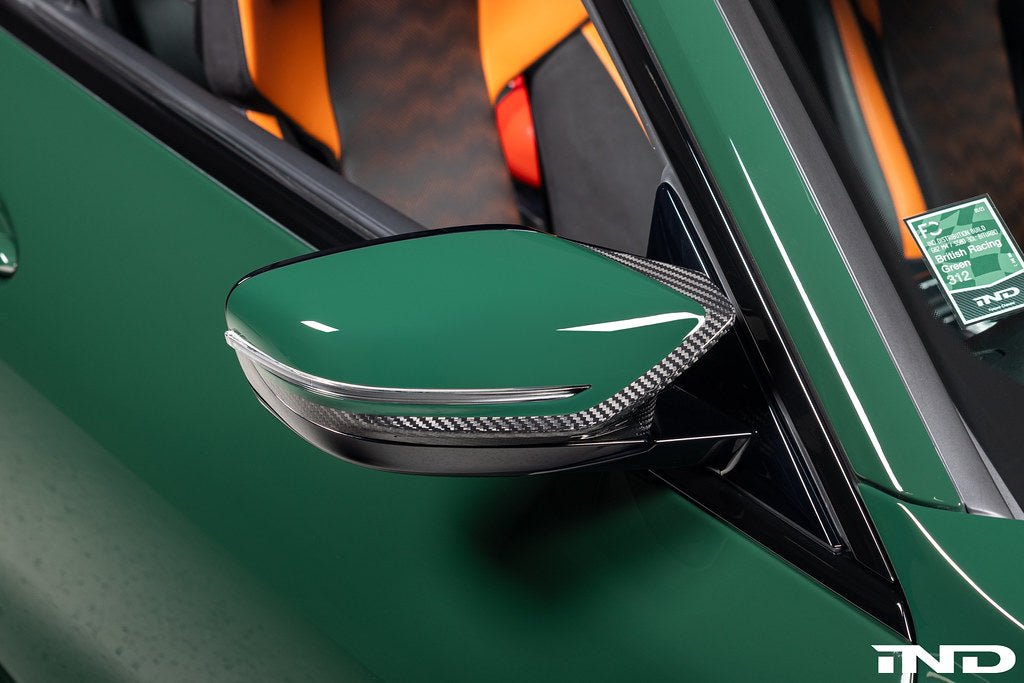Alpha N G8X M2 M3 M4 carbon mirror cap set for exterior, showing sleek black carbon fiber finish on vehicle side mirrors.