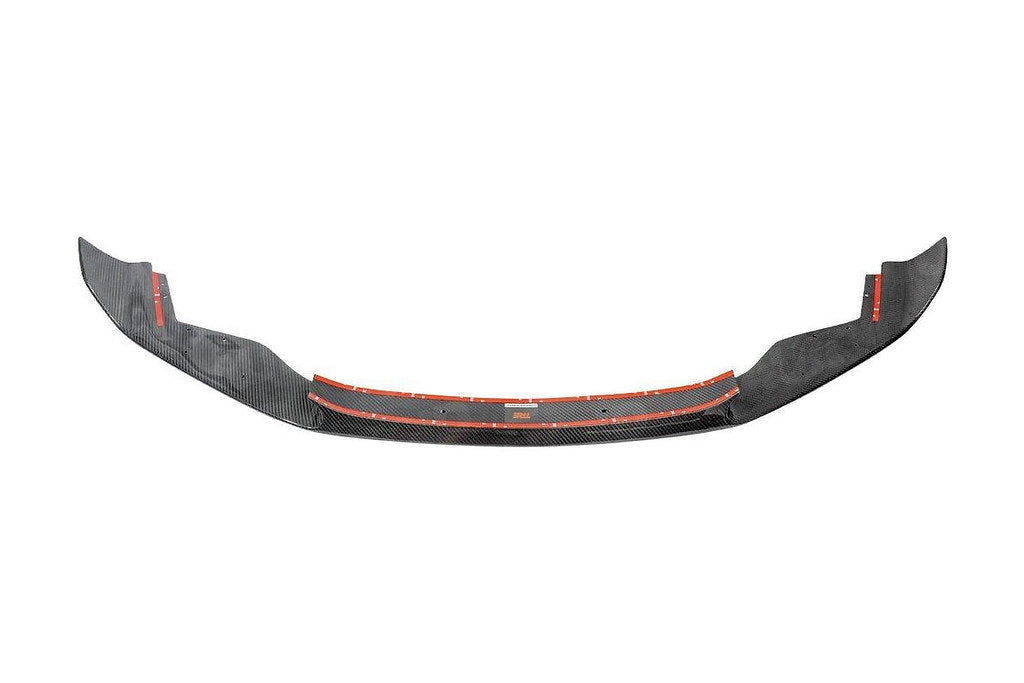 TREVORA BMW F87 M2 OG Pre-Preg Carbon Front Splitter installed on the exterior of the car, highlighting its sleek, aerodynamic design