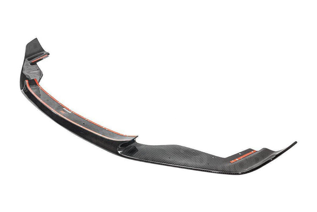 TREVORA BMW F87 M2 OG pre-preg carbon fiber front splitter installed on the exterior of the car.