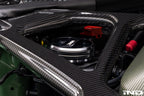 MMX Performance BMW billet coolant expansion cap with high-performance design, shown on a vehicle engine.