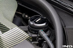 MMX Performance BMW billet coolant expansion cap, durable metal engine component with performance branding, close-up detail.