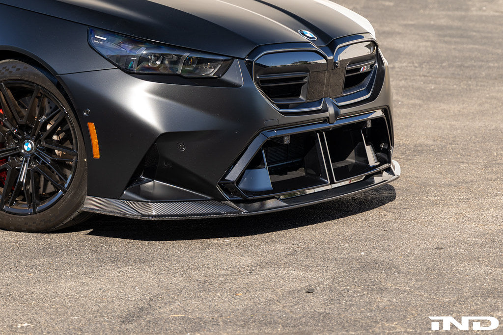 TREVORA G90 G99 M5 carbon fiber front splitter for exterior car styling, showcasing aerodynamic design and high-quality finish.