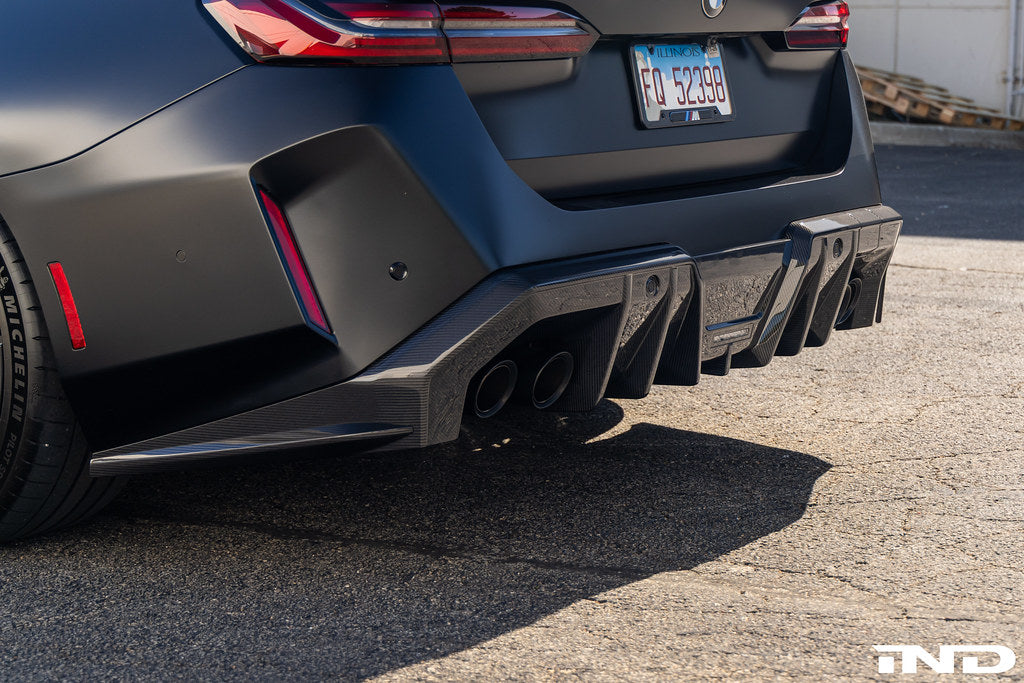 TREVORA G90 G99 M5 carbon fiber rear diffuser for exterior car modification, featuring aerodynamic design on a sleek vehicle.