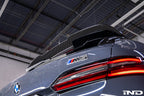 TREVORA G99 M5 carbon fiber rear roof spoiler installed on vehicle exterior, showcasing sleek aerodynamic design.
