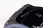 TREVORA G99 M5 carbon fiber rear roof spoiler mounted on a vehicle, showcasing its sleek exterior design and aerodynamic profile.