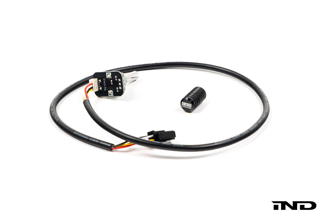 CANchecked black turnknob with cover for MFD15 display interior control panel, showcased on a white background