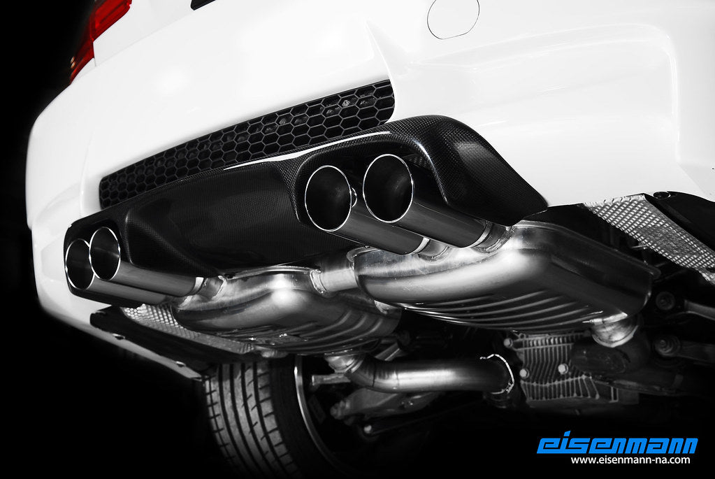 Eisenmann E92/E93 M3 performance exhaust system with dual exhaust tips and stainless steel construction, installed on a sports car.