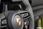 MAED Porsche 911 (992) billet magnetic shift paddle set installed in the interior of the sports car.