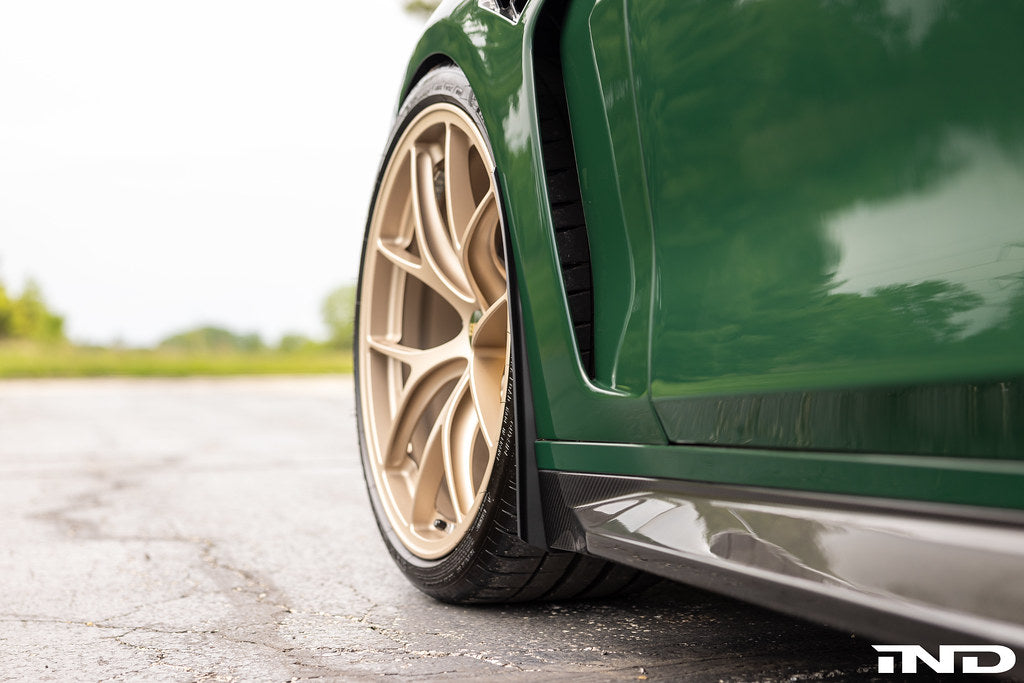 Megachip G8X M2, M3, M4 exterior splash guard set installed on vehicle, providing protection against road debris and water.