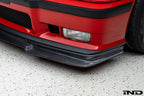 Alpha N E36 M3 Carbon GT Front Lip installed on red BMW E36 M3, exterior car modification for sporty aerodynamic look.