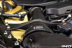 Karbonius gloss carbon fiber strut brace set for BMW G90 M5 and G99 M5 installed in engine bay