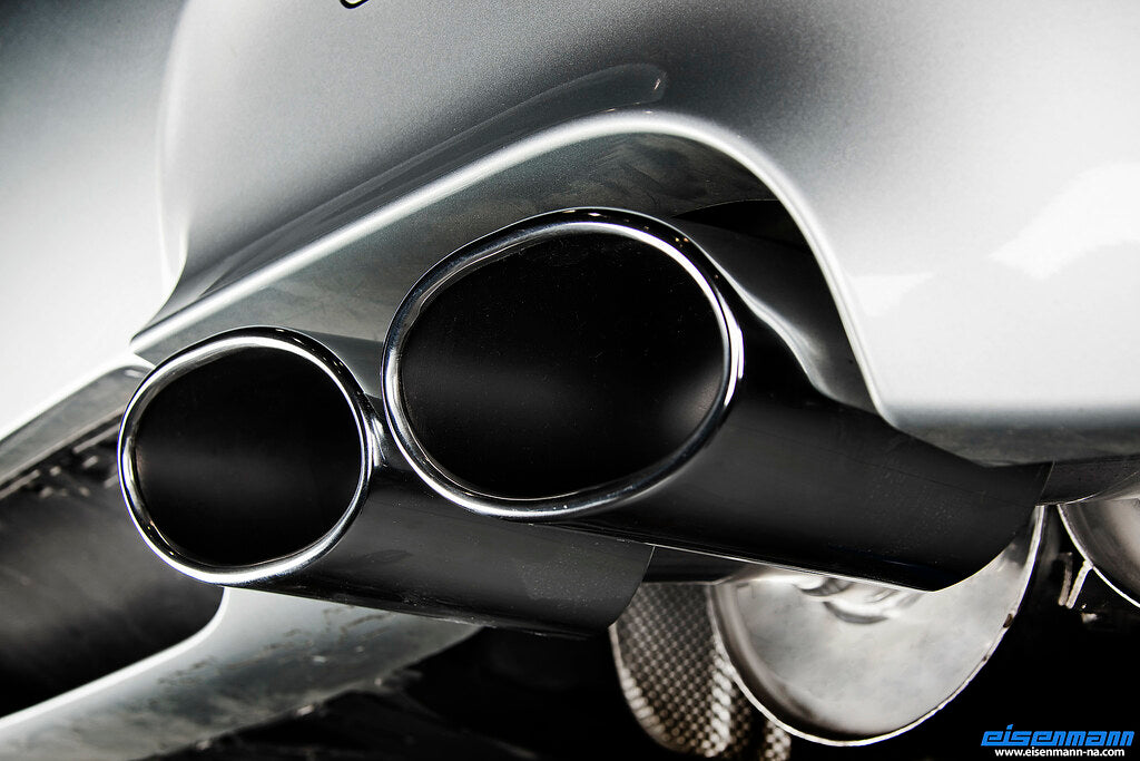 Eisenmann E60 M5 performance exhaust system with polished metal pipes and dual exhaust tips on a car.
