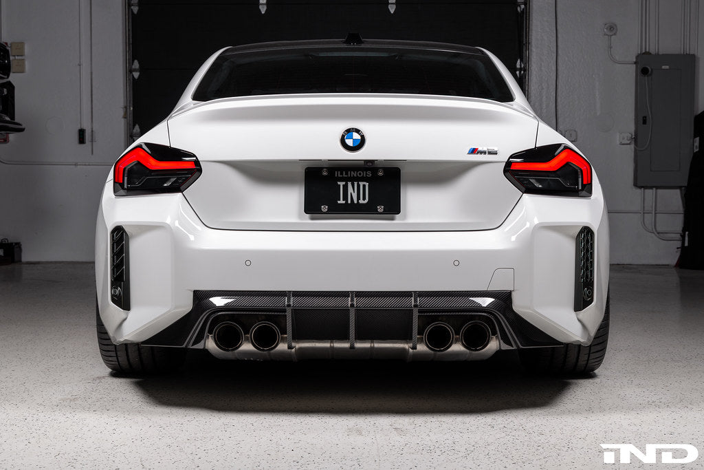 Acexxon G87 M2 Full Replacement Rear Reflector Insert Set featuring both honeycomb and horizontal designs installed on an Alpine White BMW G87 M2.