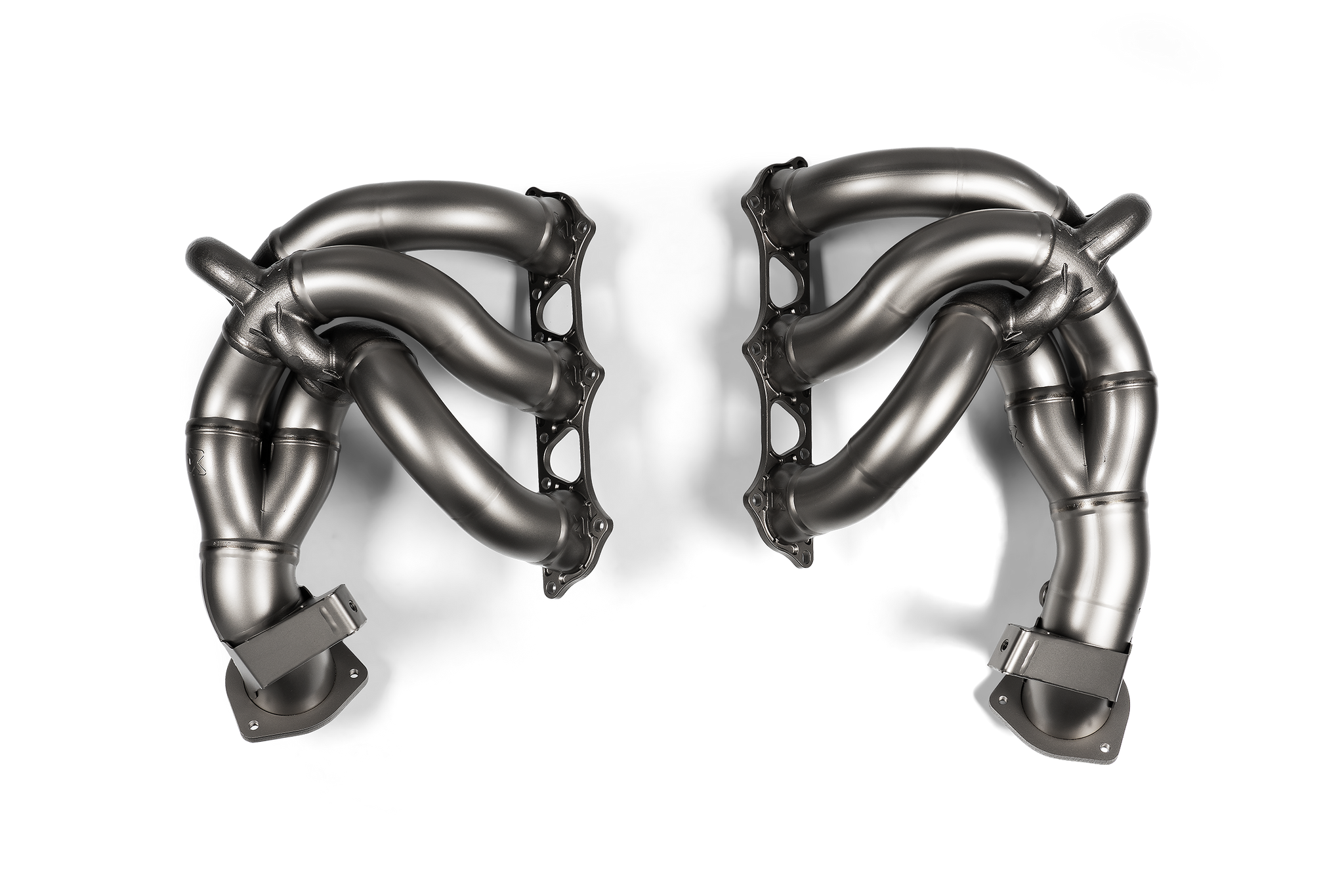 Akrapovic titanium exhaust header set for Porsche 718 Cayman GT4 RS and Spyder RS (982) shown from overhead angle.