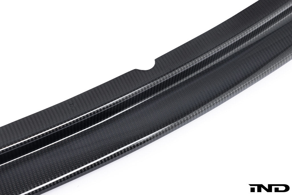 Alpha N E36 M3 Carbon GT front lip exterior car part on white background, showcasing the sleek carbon fiber design.