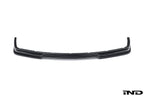Alpha N E36 M3 Carbon GT front lip installed on a white background, showcasing its sleek exterior design and carbon fiber finish.