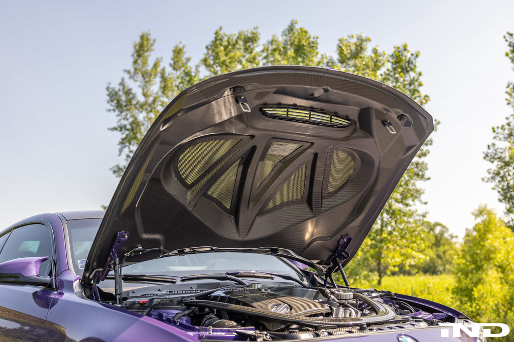Alpha-N carbon GTS hood installed on BMW F82 M4 showing motorsport vented carbon fiber design