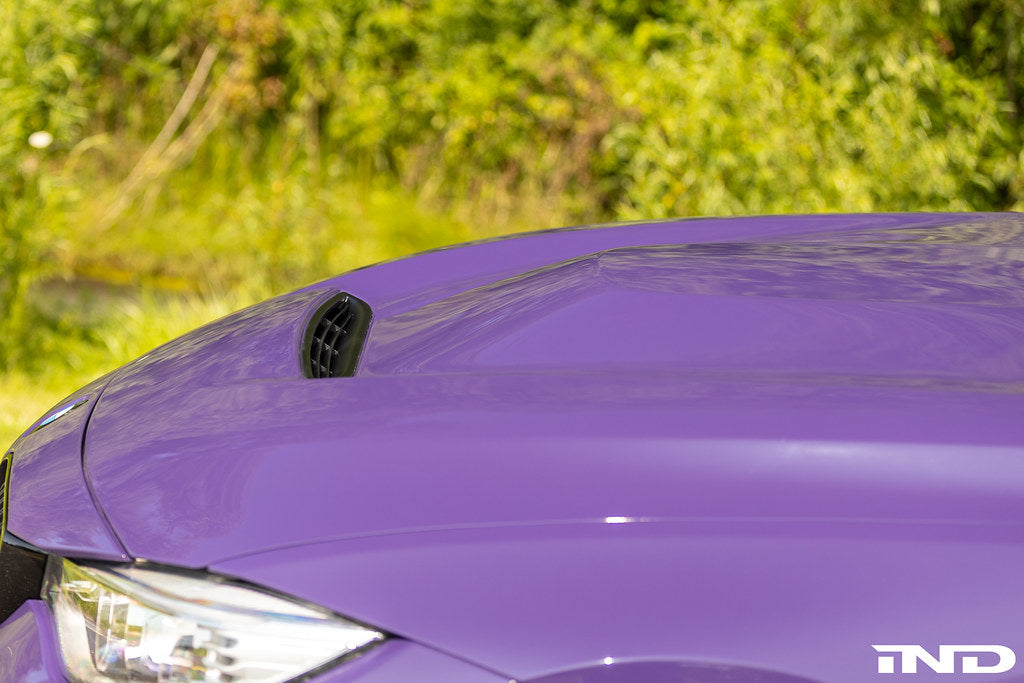 Alpha-N carbon GTS hood installed on BMW F82 M4 showing motorsport vented carbon fiber design