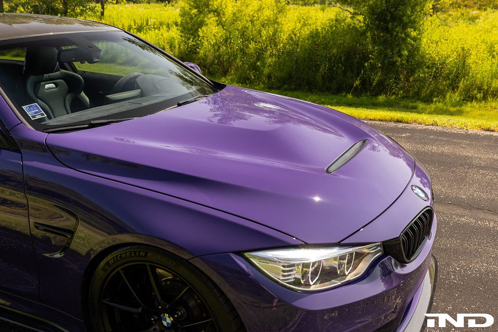 Alpha-N carbon GTS hood installed on BMW F82 M4 showing motorsport vented carbon fiber design