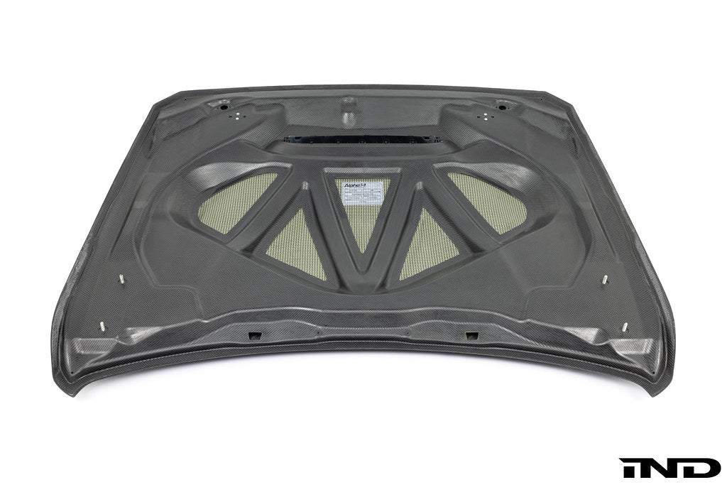 Alpha-N F82 M4 carbon GTS hood in raw carbon fiber on white background