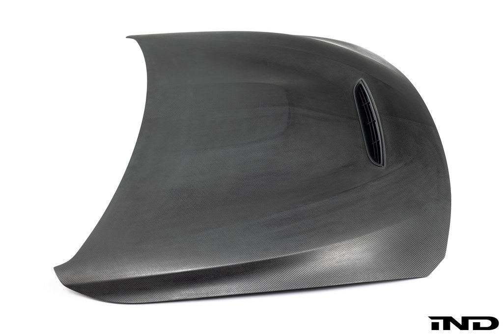 Alpha-N F82 M4 carbon GTS hood in raw carbon fiber on white background