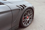 Alpha N F82 M4 carbon vented front fender set installed on a vehicle, showcasing sleek, lightweight exterior car modification.