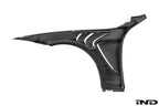 Alpha-N F82 M4 carbon vented front fender set installed on a white background, showcasing lightweight, aerodynamic exterior car modifications.