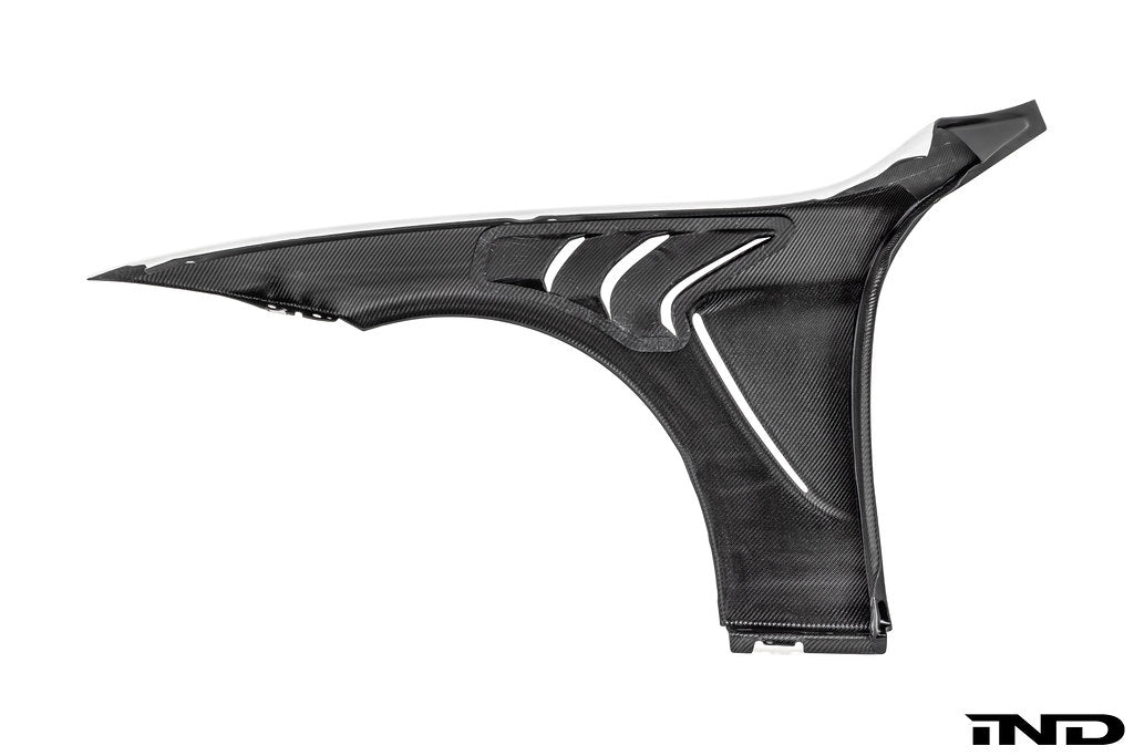Alpha-N F82 M4 carbon vented front fender set installed on a white background, showcasing lightweight, aerodynamic exterior car modifications.