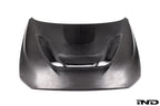 Alpha N F87 M2 Carbon Corse vented hood in white, showing the exterior design and venting details on a plain background.